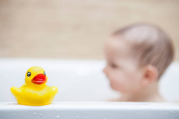 istock Rubber duck over the bathtube 595336016