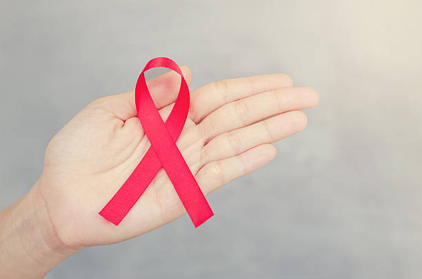 istock HIV, AIDS awareness ribbon. 595336126