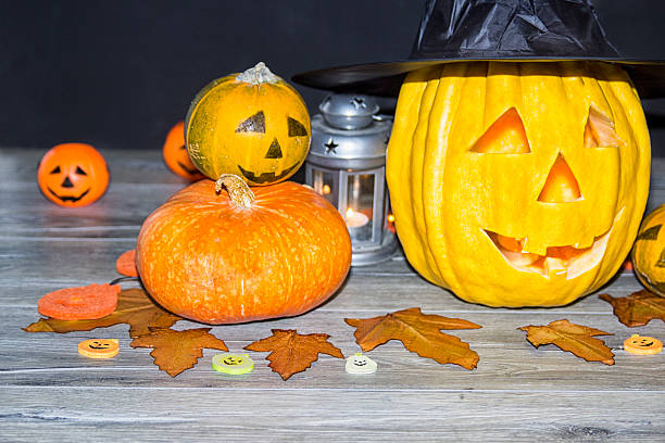 istock Halloween pumpkin head jack lantern on wooden background 595336552