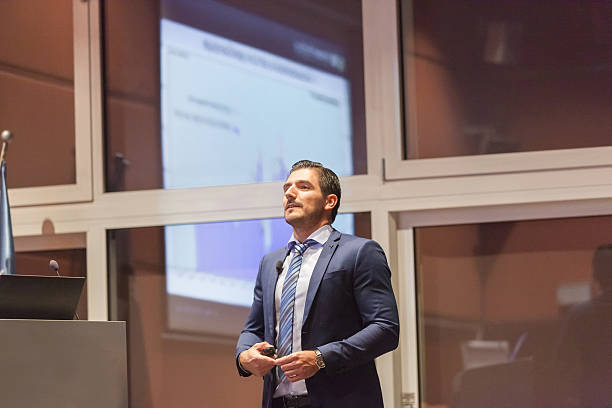 istock Speaker giving talk at Business Conference. 595339122