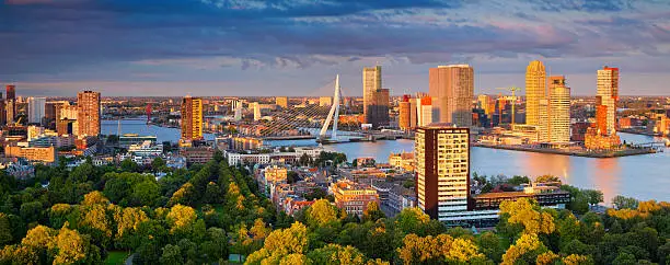 Panoramic image of Rotterdam, Netherlands during summer sunset. This is composite of two horizontal images stitched together in photoshop.