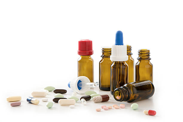 istock pills, capsules and pharmacy bottles isolated on a white background 595341024