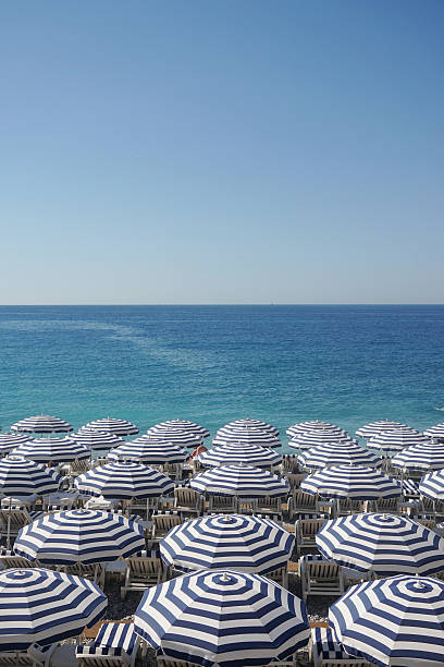 istock Beach umbrellas and sun loungers on a beach 595341148
