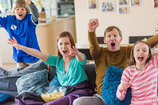 istock Family watching TV 595341432