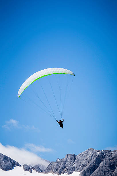 istock paragliding over the Alps mountains 595341692