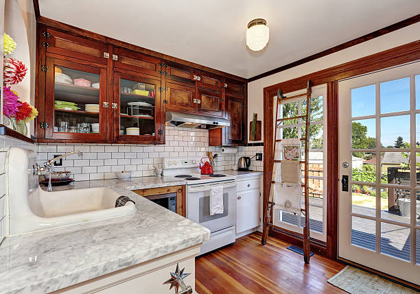 istock Vintage kitchen cabinets and white tile back splash trim 595343102