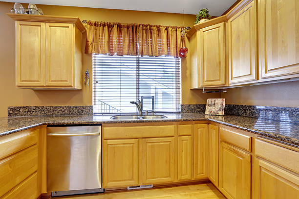 istock Light tones kitchen interior with modern wooden cabinets. 595343930