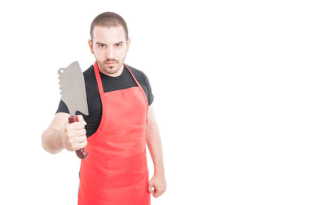 istock Serious male butcher showing meat chopper 595344468
