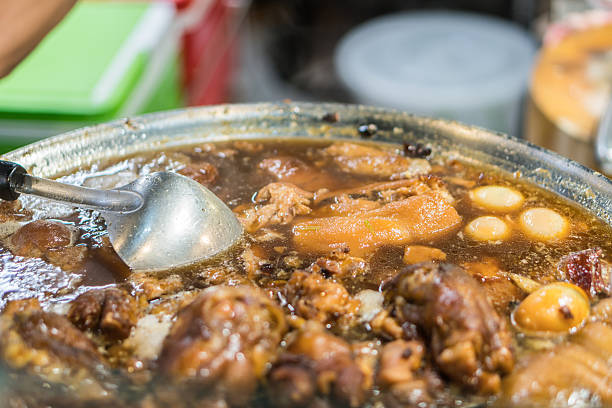 istock Stewed pork leg on rice,thai food 595345108