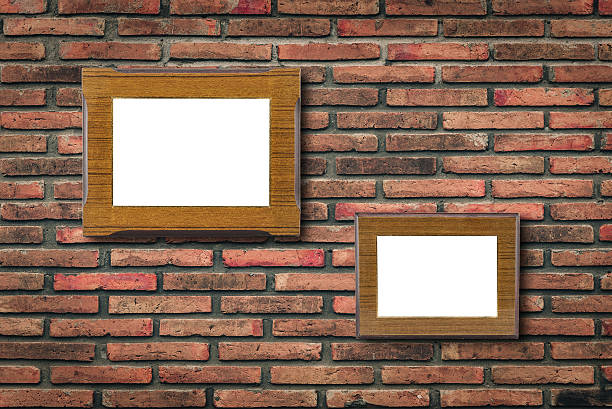 istock Blank photo wood frame on old brick wall 595347084