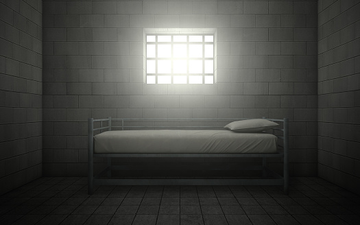 Dark prison cell with light shining through a barred window. 3d rendering
