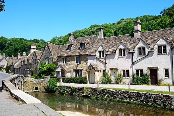 istock Cottages alongside the river Bybrook, Castle Combe. 595348256