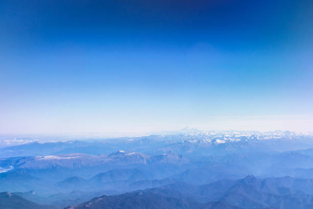 clouds over caucasus mountains - mountain range earth sky airplane imagens e fotografias de stock