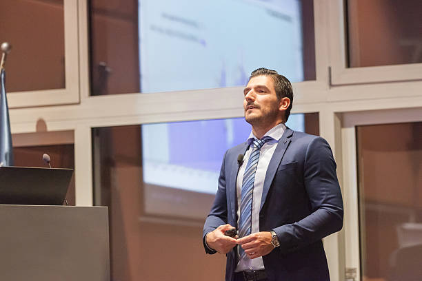 istock Speaker giving talk at Business Conference. 595348374