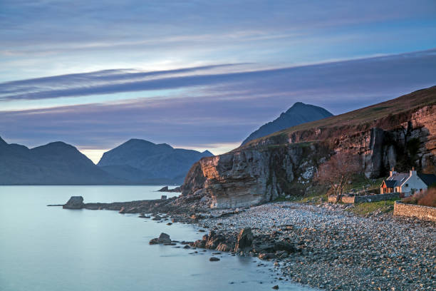 istock House on remote beach among cliffs, Elgol, Skye, Scotland 595348483