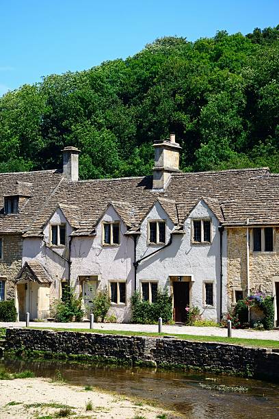 istock Cottages alongside the river, Castle Combe. 595348646