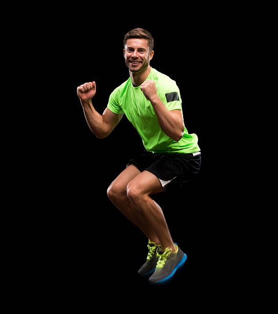 istock Cheerful male athlete cheering and jumping 595348932