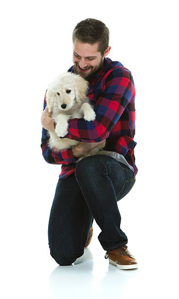 istock Cheerful man embracing with dog 595351118