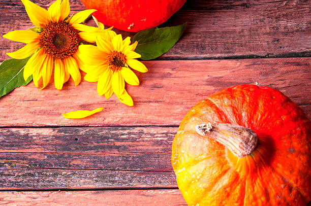 istock Pumpkin on vintage wooden table. Copyspace. View from above 595351270