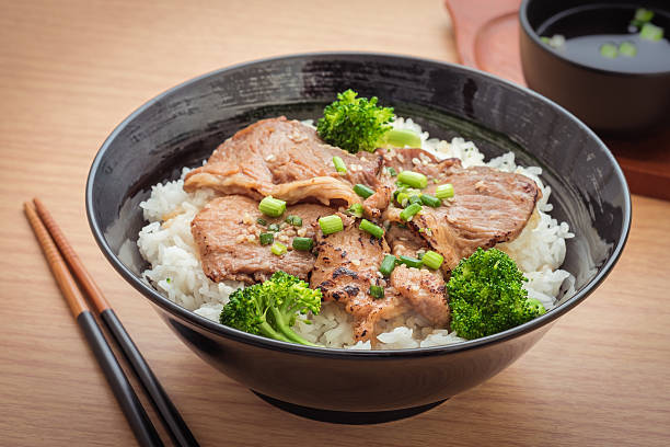 istock Roasted pork with stir fried broccoli and japanese rice 595352638