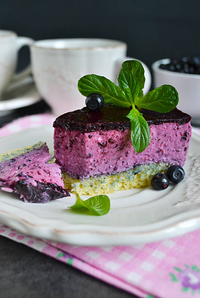 Blueberry mousse cake on a black background