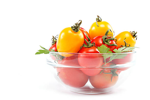 istock Tomatoes in a glass on a white background. 595359178