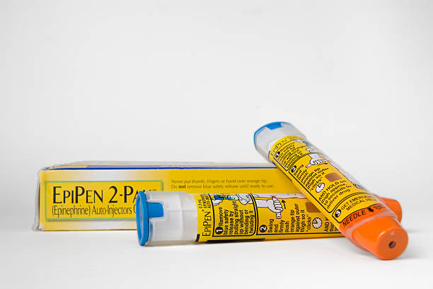 Two Epipens and box Saint Louis, United States - August 25, 2016: Two EpiPen auto-injectors used for treatment of allergic reactions. injection-pen stock pictures, royalty-free photos & images