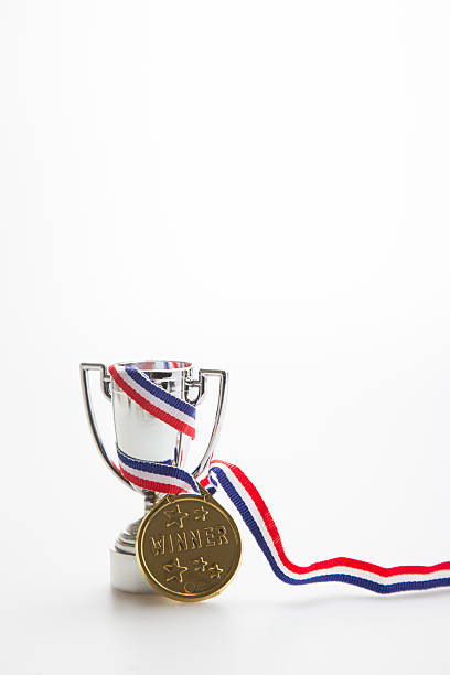 istock Gold medal winner with trophy 595359724