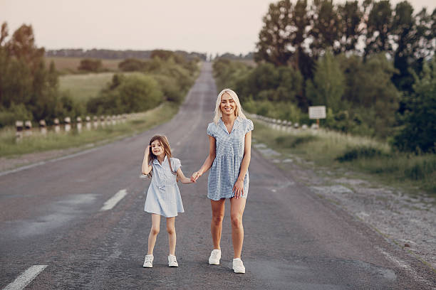 istock mom and daughter outside 595359786