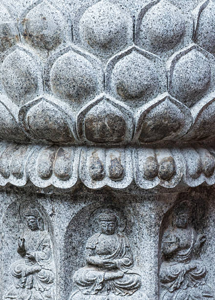 istock Buddha statue and lotus leaves carving. 595360670
