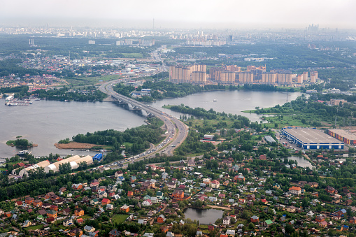 Areal view of Moscow in the far end and surrounding area; approaching Sheremetyevo international airport, Russia.