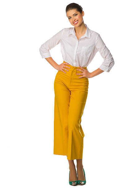 istock Young girl in yellow pants 595362600