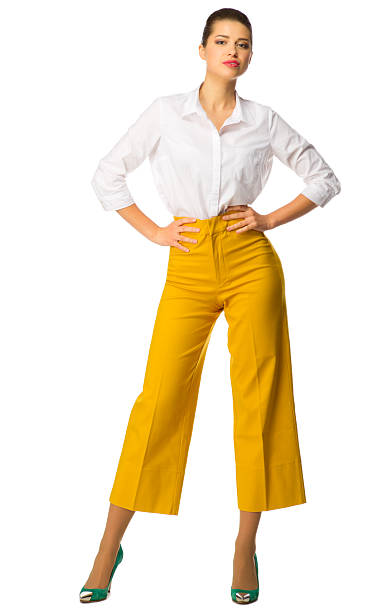 istock Young girl in yellow pants 595362664