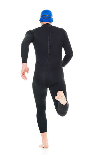 istock Rear view of swimmer running 595362690