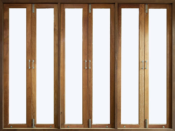 istock Tall wooden windows blured background in living room 595363110