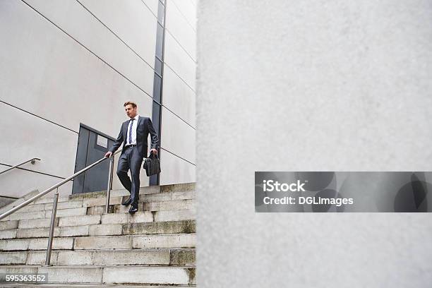 Businessman On The Stairs Stock Photo - Download Image Now - Walking, Moving Down, Staircase