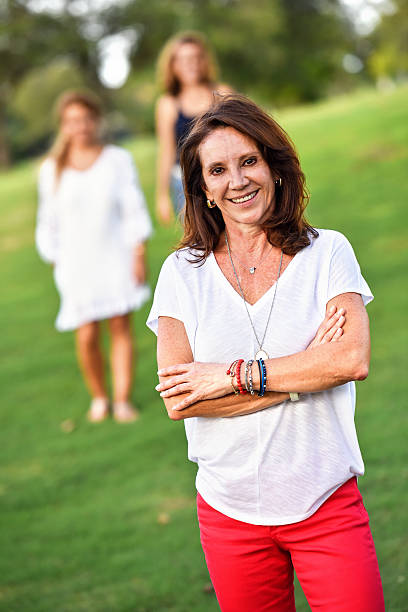 istock Mature women posing at the park 595364992