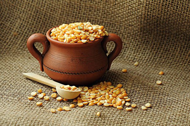 istock Dry peas in a clay pot. 595366034