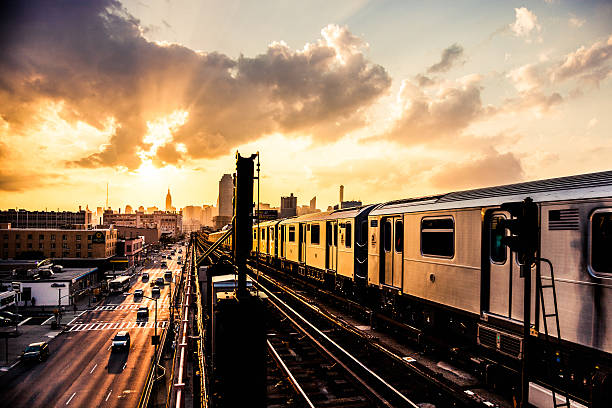 Sunset over New York skyline Sunset over New York skyline, on the subway overground train station cityscape videos stock pictures, royalty-free photos & images