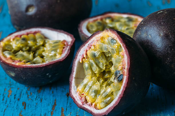istock Fresh juicy passion fruits. Tropic fruit concept 595366372