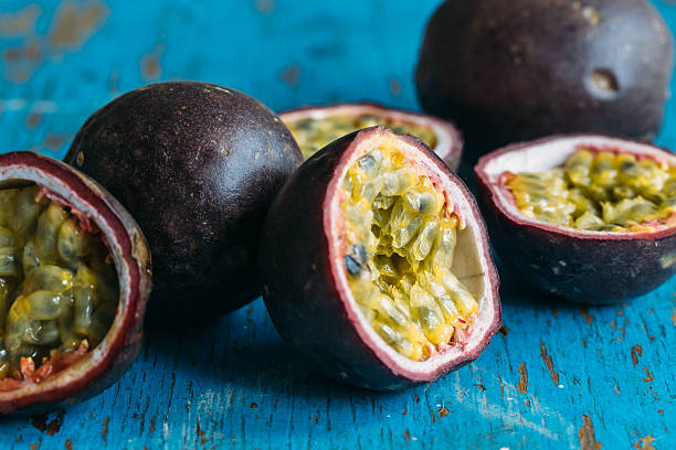 istock Fresh juicy passion fruits. Tropic fruit concept 595366400