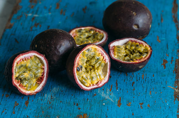 istock Fresh juicy passion fruits. Tropic fruit concept 595366452