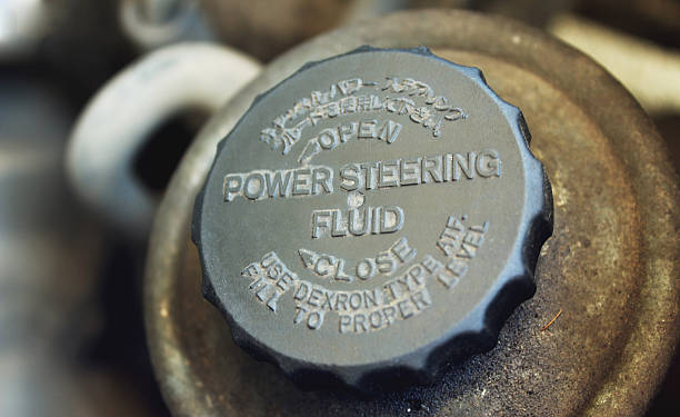 Old worn cap of power steering reservoir stock photo