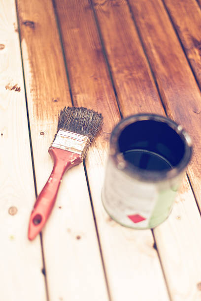 istock painting wooden table using paintbrush 595725328