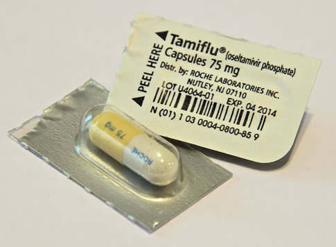 Shreveport, Louisiana, USA - August 26, 2016: Close-up photo of the front and back of Tamiflu antiviral capsule packs with an expired expiration date.