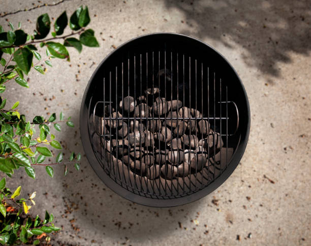istock Charcoal BBQ on a Cement Patio 595727780