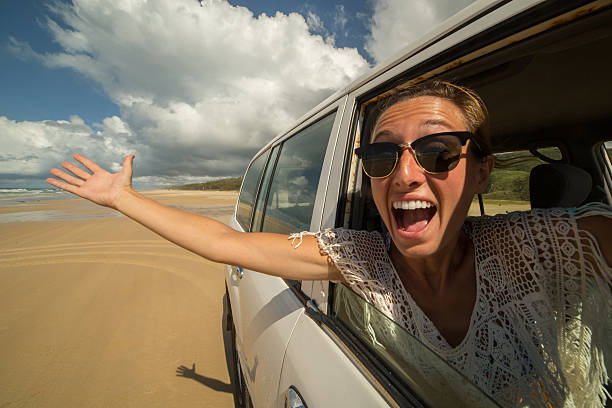 istock Girl takes selfie while driving a 4x4 on Fraser Island 595729882