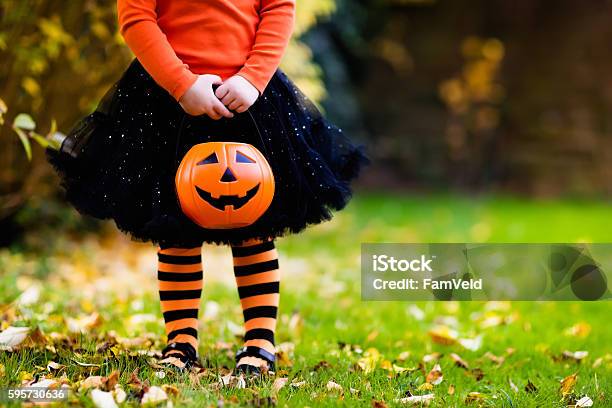 Little Girl Having Fun On Halloween Trick Or Treat Stock Photo - Download Image Now - Trick Or Treat, Child, Halloween