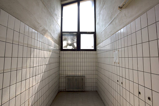 istock Claustrophobic small room with white tiles 595731586