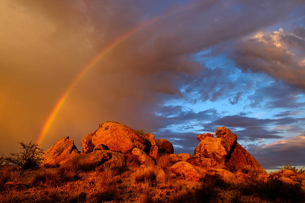 istock Rainbow in the desert sky at Sunrise. 595732582